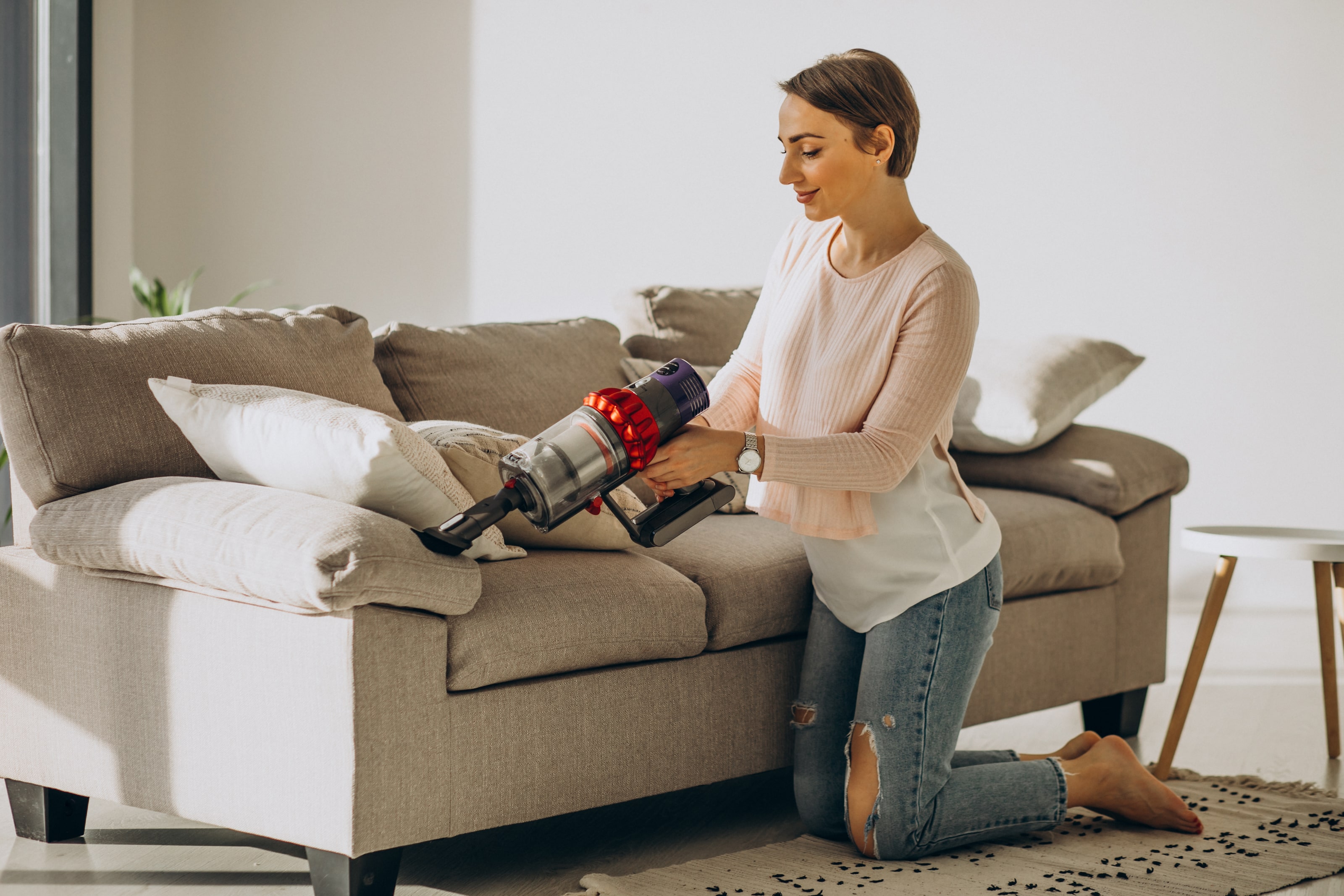 Compact mini desk vacuum held in hand